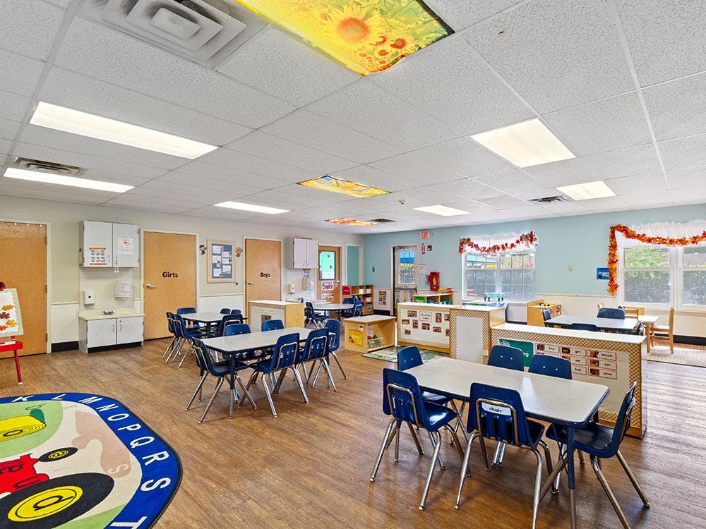 Classroom with multiple tables and chairs