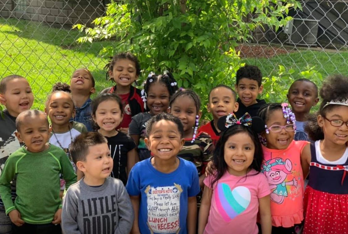 Group of children standing together outdoors