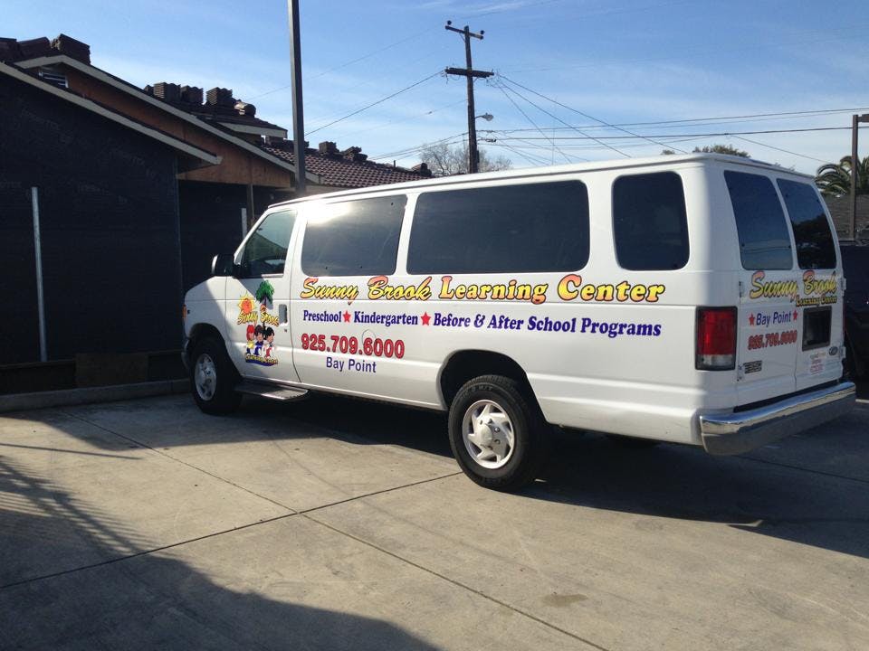 White van with "Sunny Brand Learning Center" text on the side