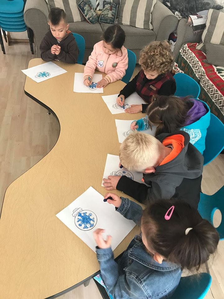 Children drawing at a table
