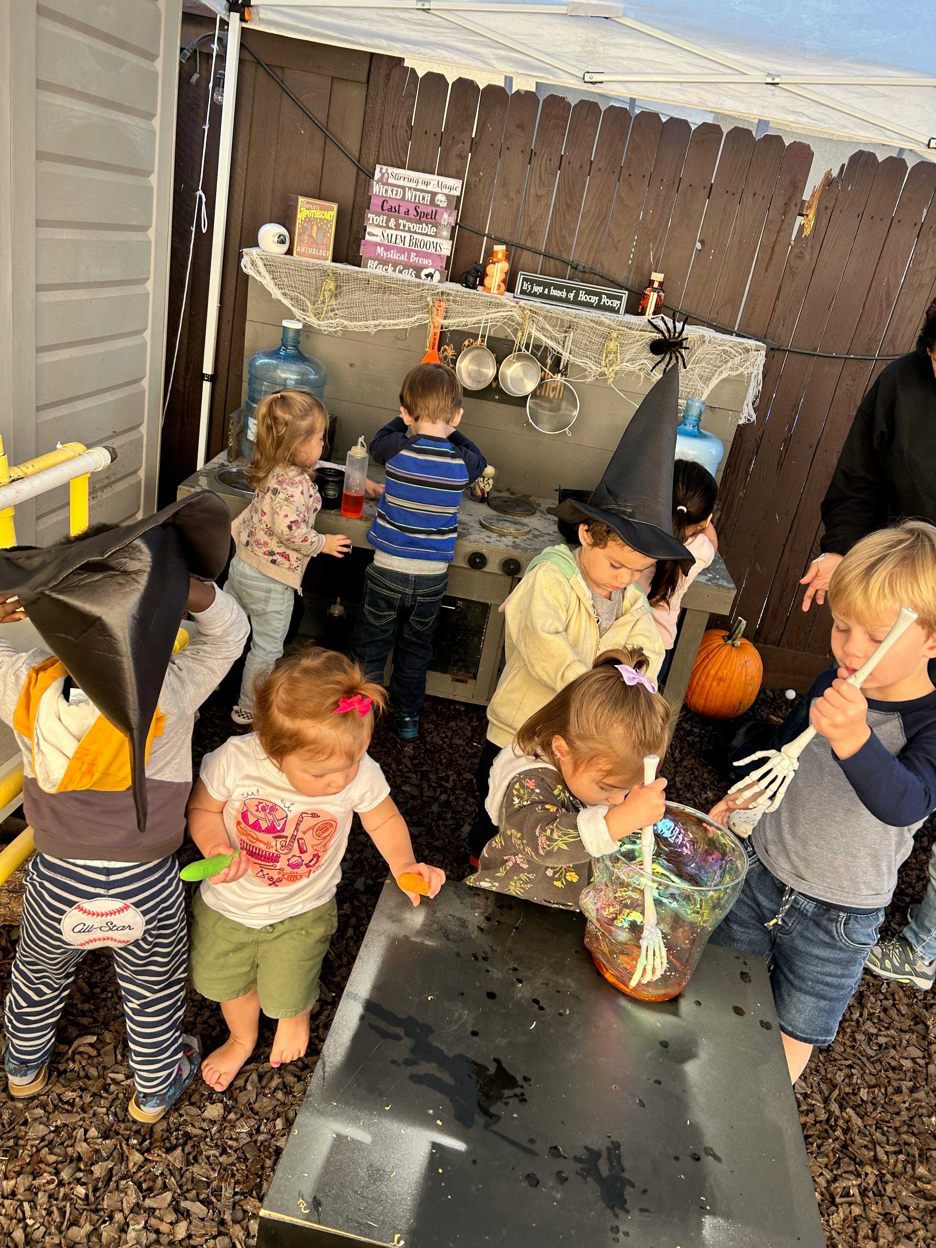 Children in Halloween costumes playing outdoors