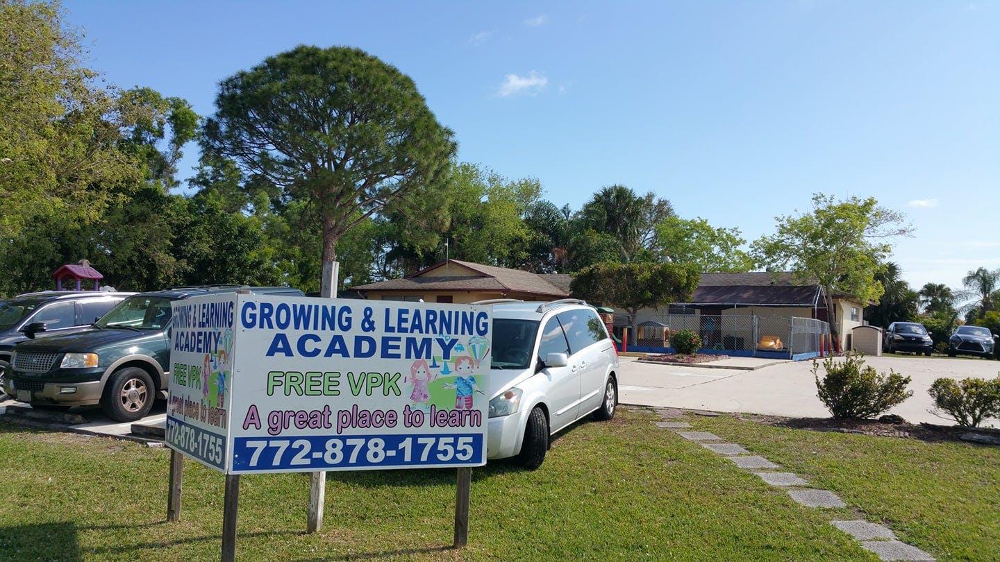 Sign for Growing & Learning Academy with a phone number