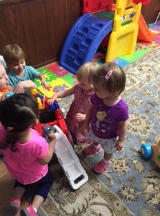 Children playing with toys in a room