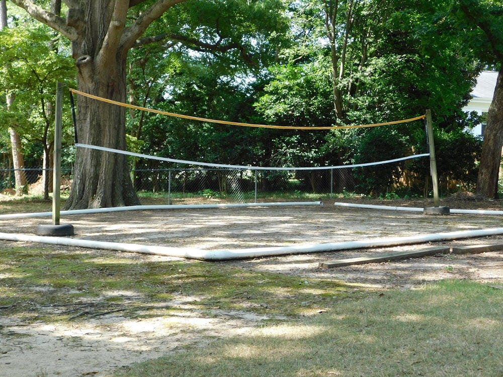 Outdoor volleyball court with net and boundary lines