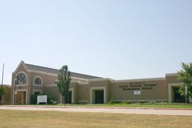 Exterior of a school building with a sign that reads "Elementary School"
