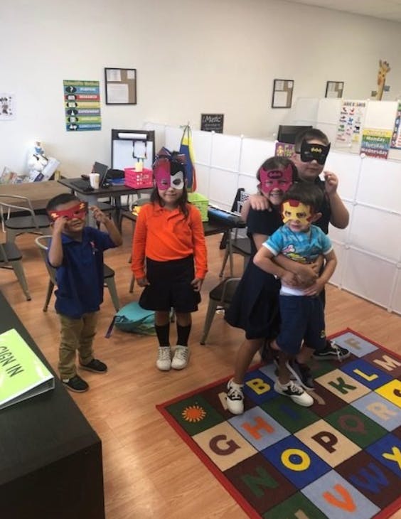 Children wearing masks in a classroom