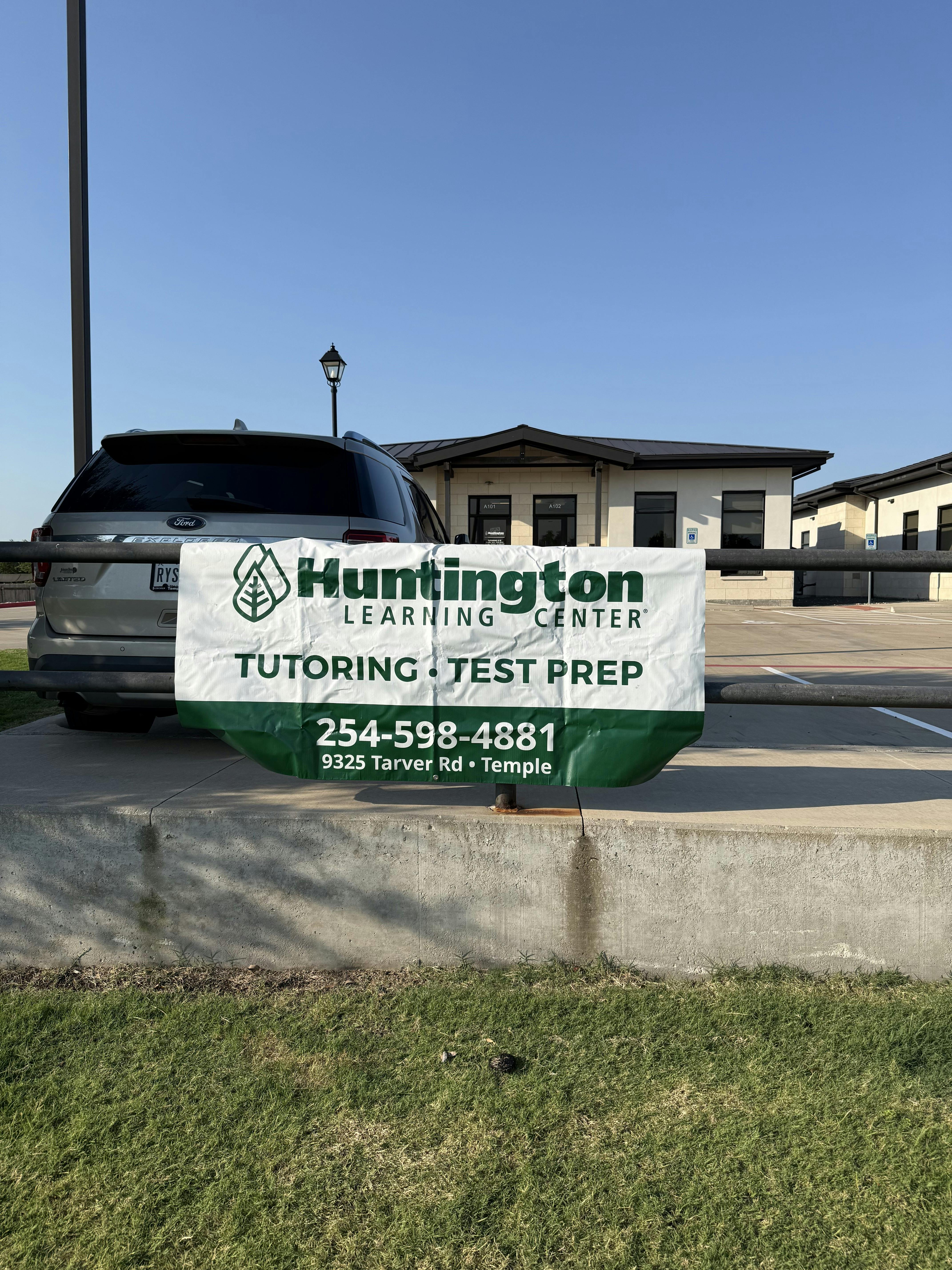 Huntington Learning Center sign in front of a building parking lot