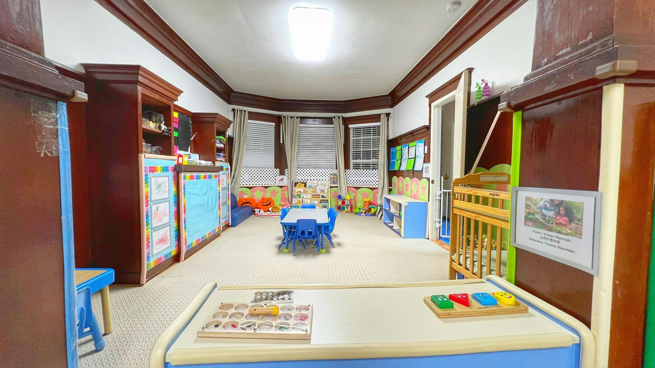 Empty classroom with small tables and chairs