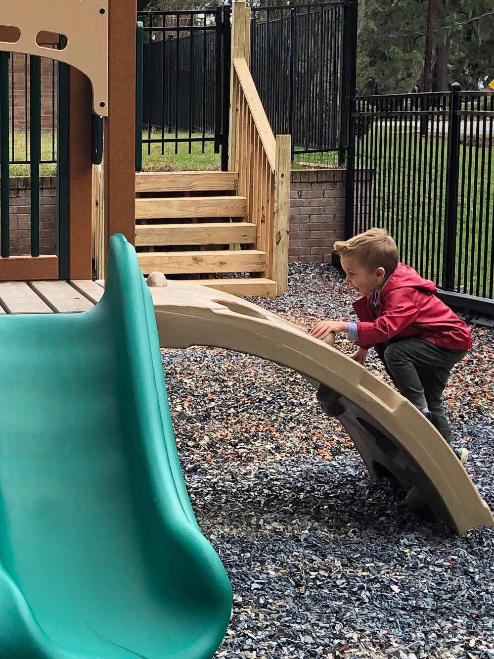 Child climbing on a playground slide