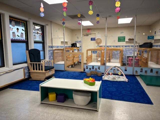 cribs in a daycare classroom