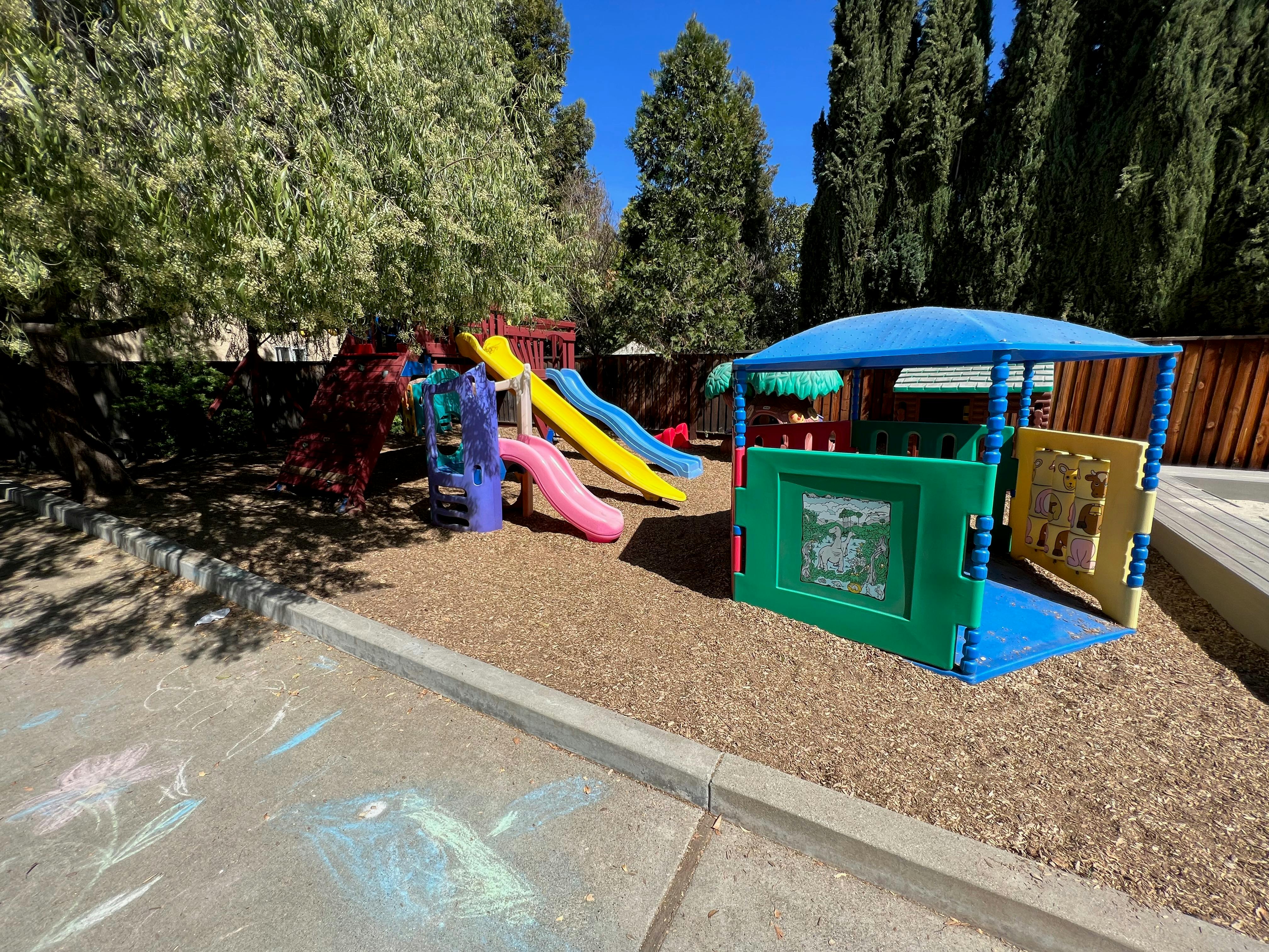 Playground with slides and play structure on wood chips
