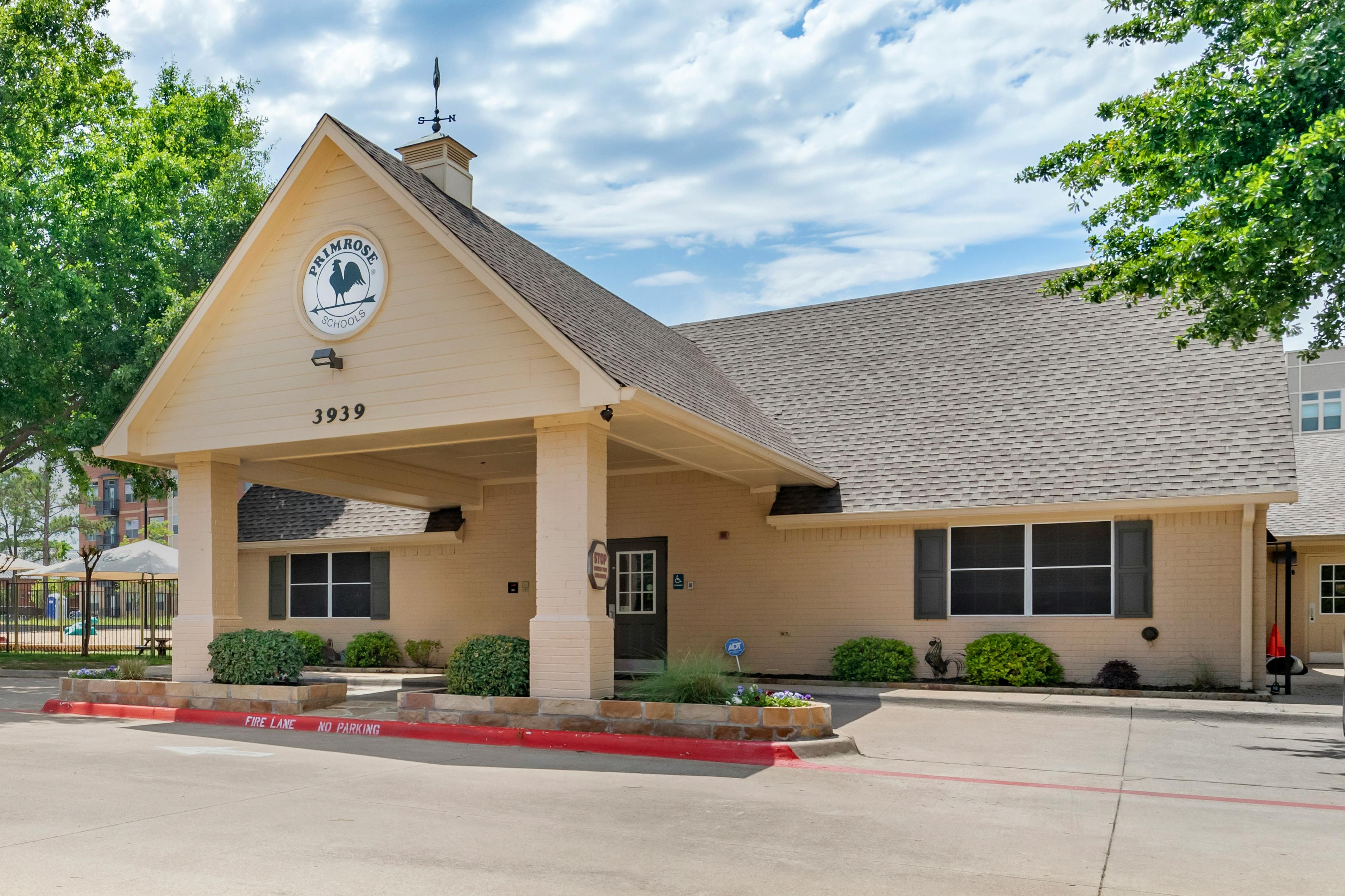 Exterior view of a Primrose Schools building entrance with a covered driveway