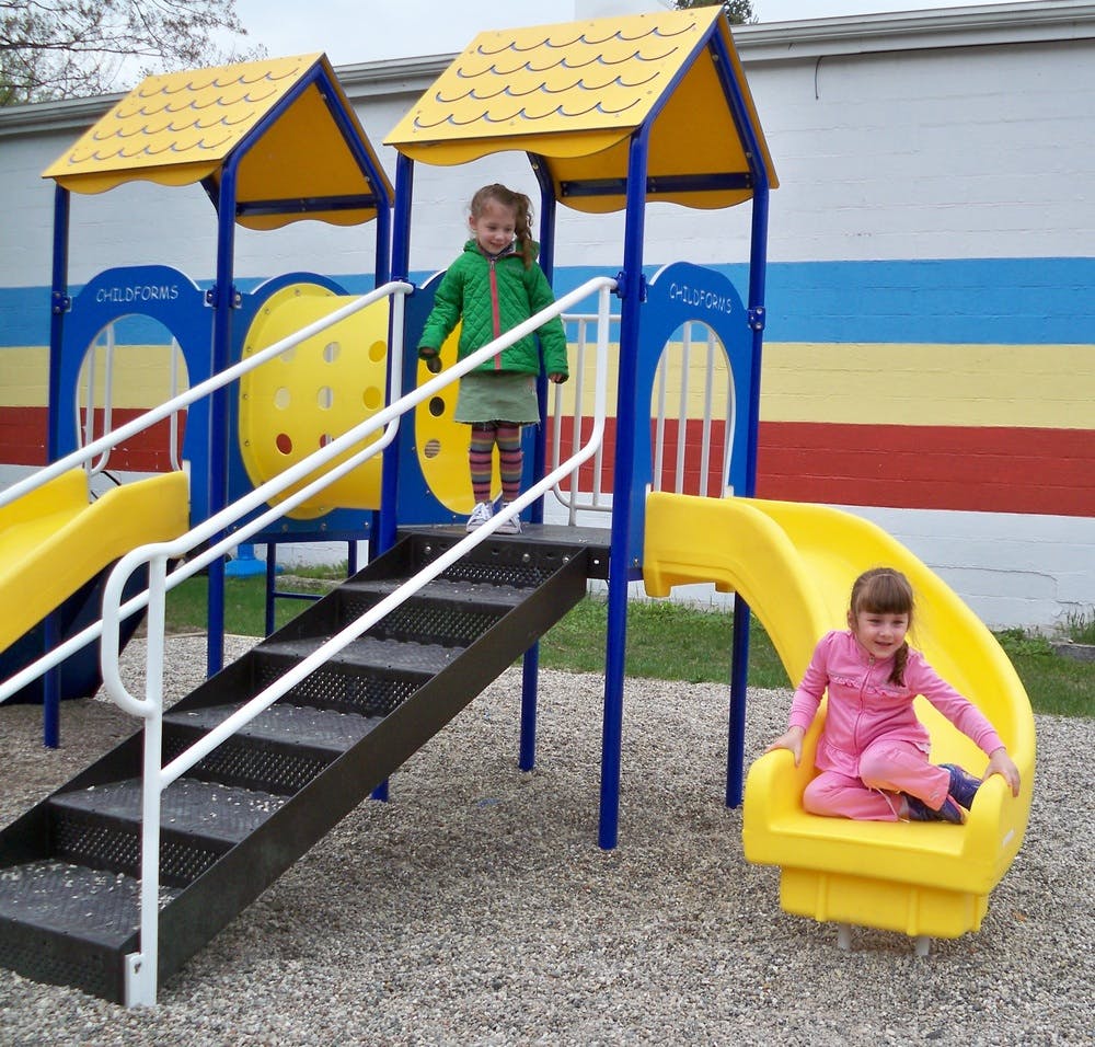 Two children on a playground structure