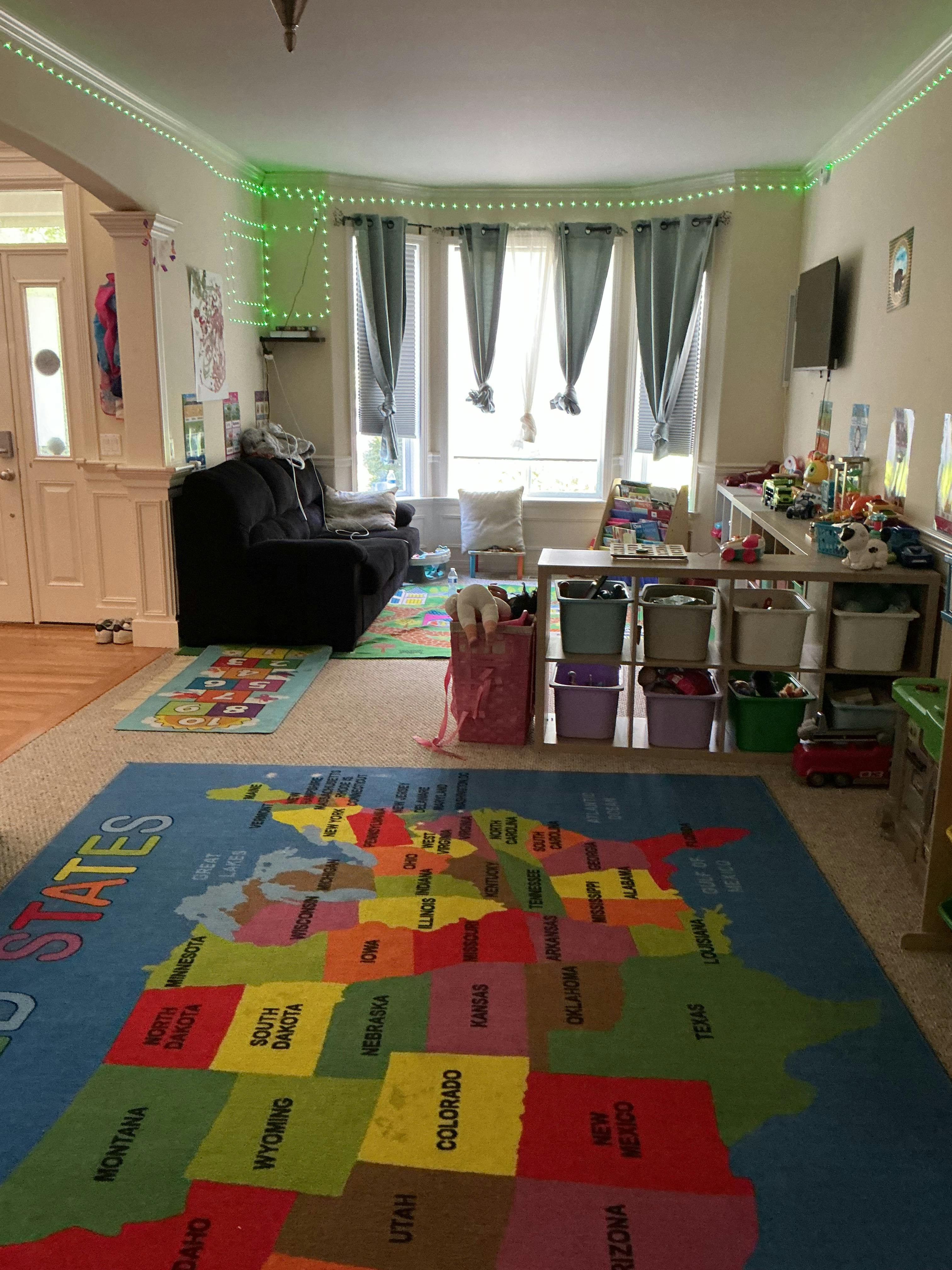 Playroom with a map of the United States rug and storage shelves
