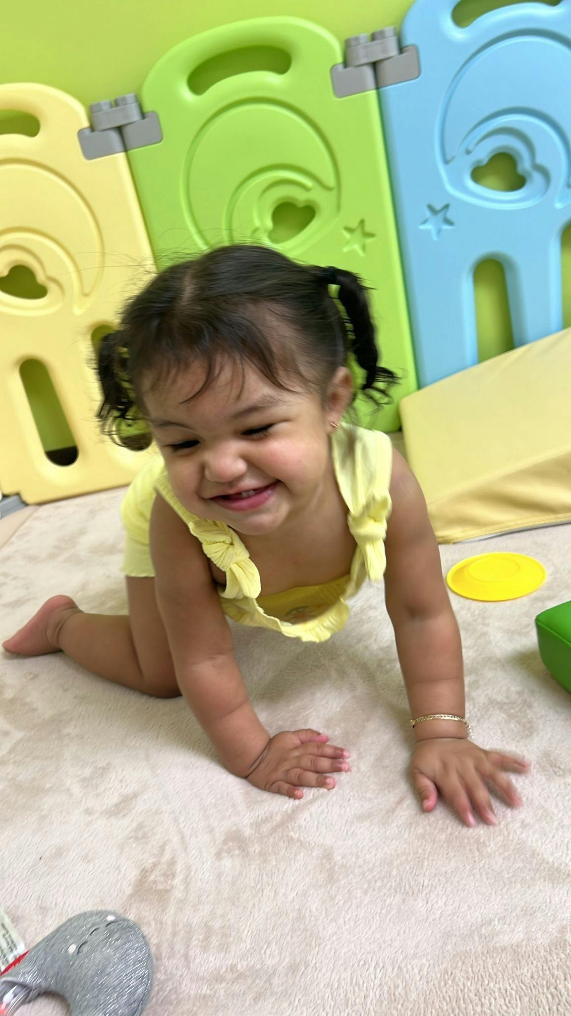 Child crawling on a rug