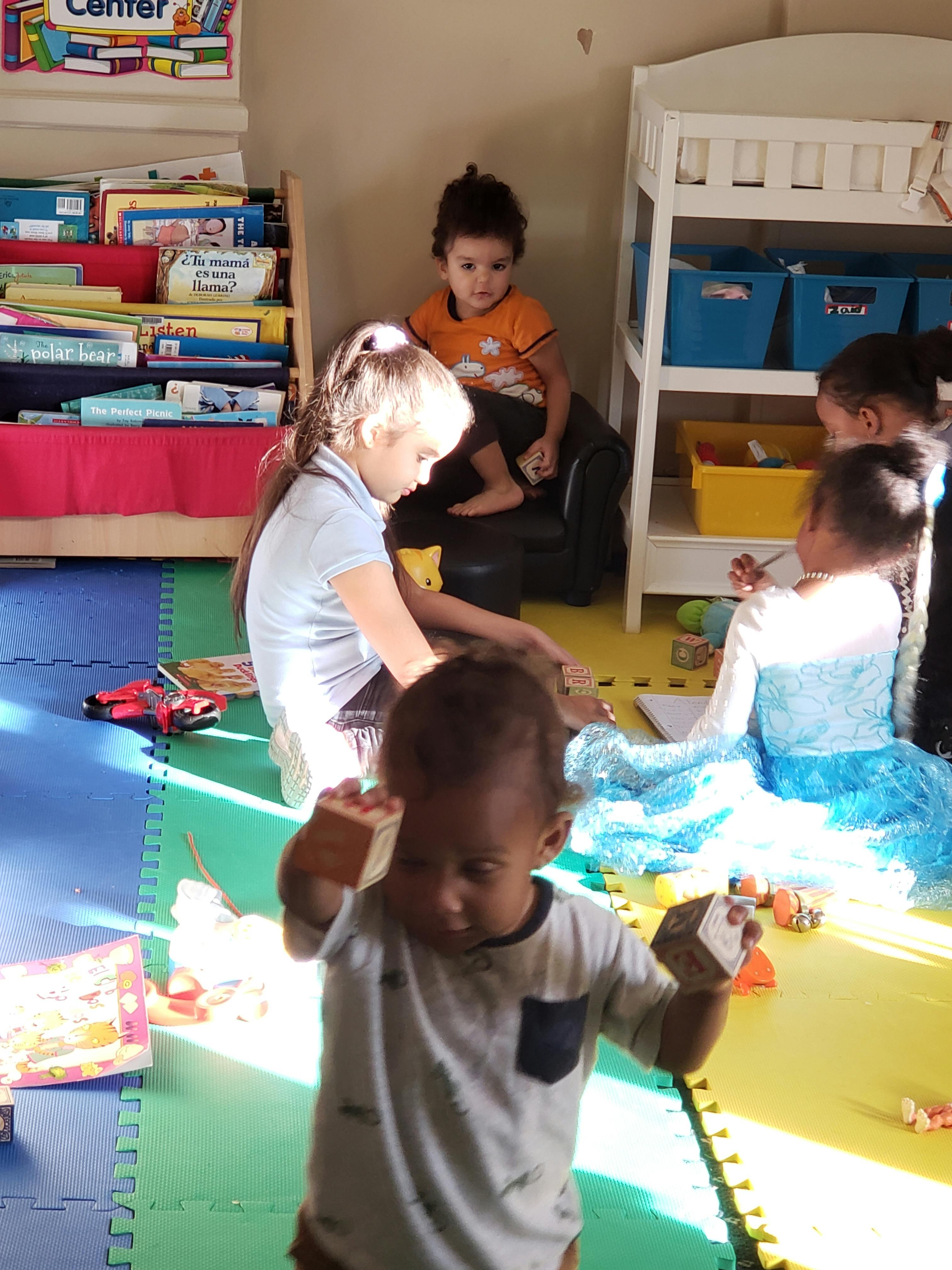 Children playing with toys in a classroom