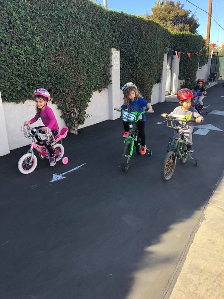 Children riding bicycles on a paved path
