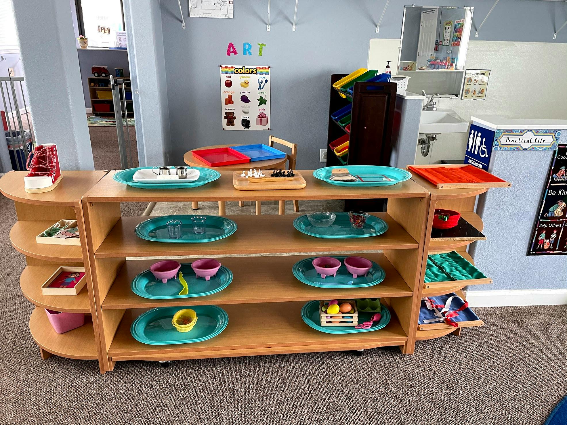 Shelves with trays and bowls in a classroom