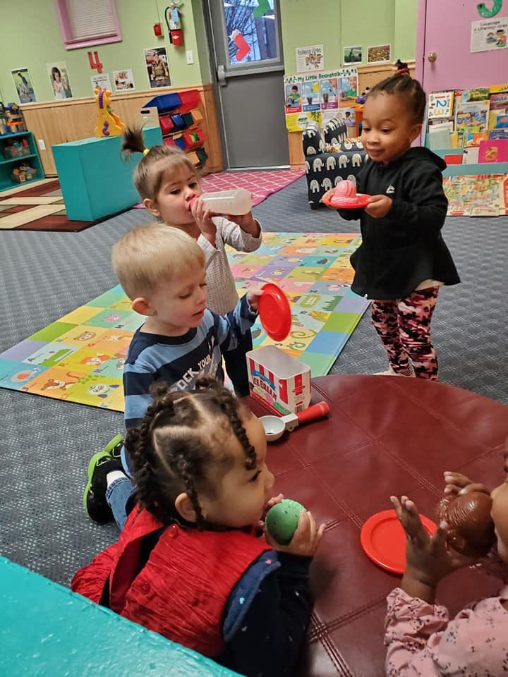 Children playing with toys in a classroom