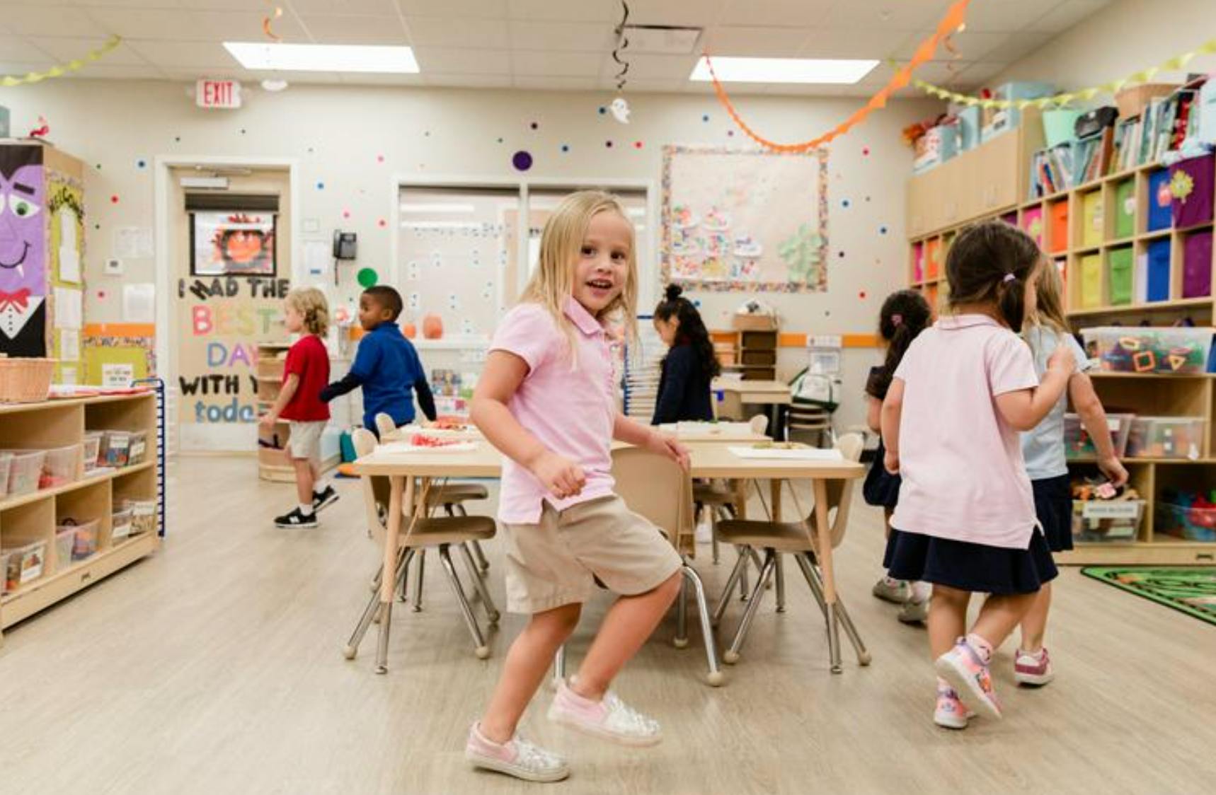 Children in a classroom, one child in the foreground
