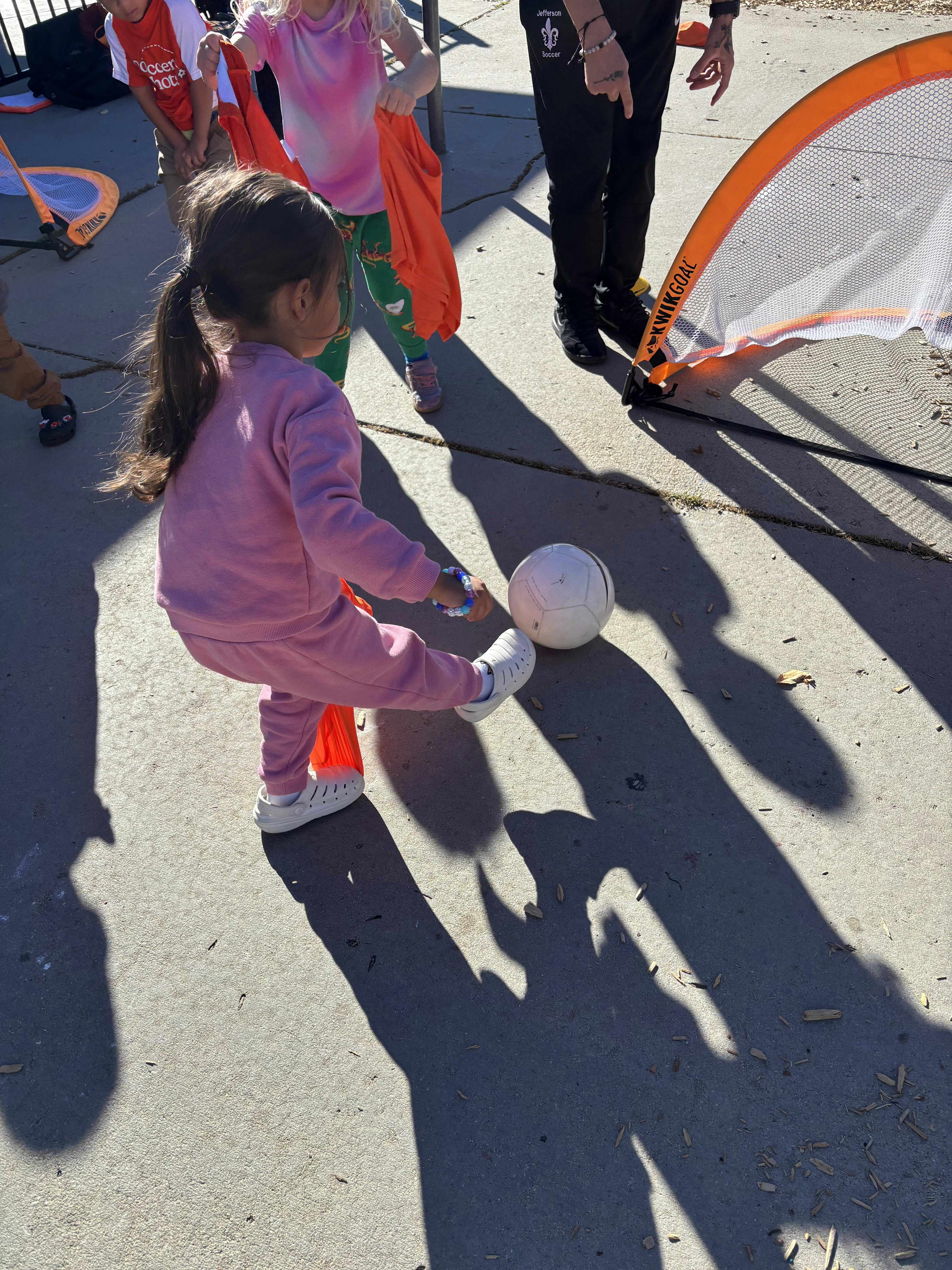 Child kicking a soccer ball