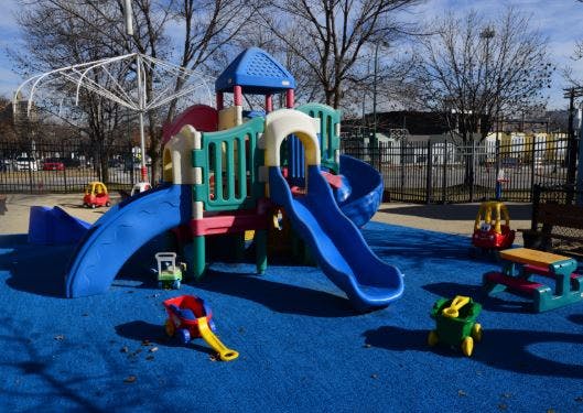 Colorful playground structure with slides on a blue ground