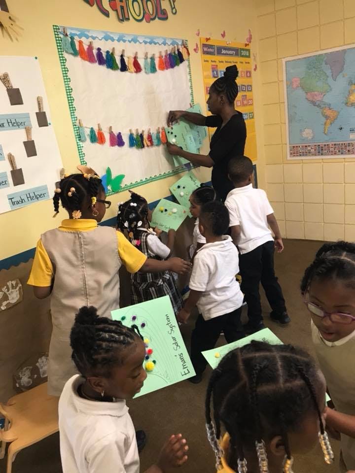Adult and children in a classroom