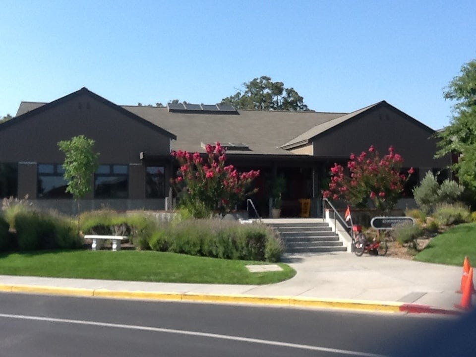 Building with a gabled roof and steps leading to an entrance