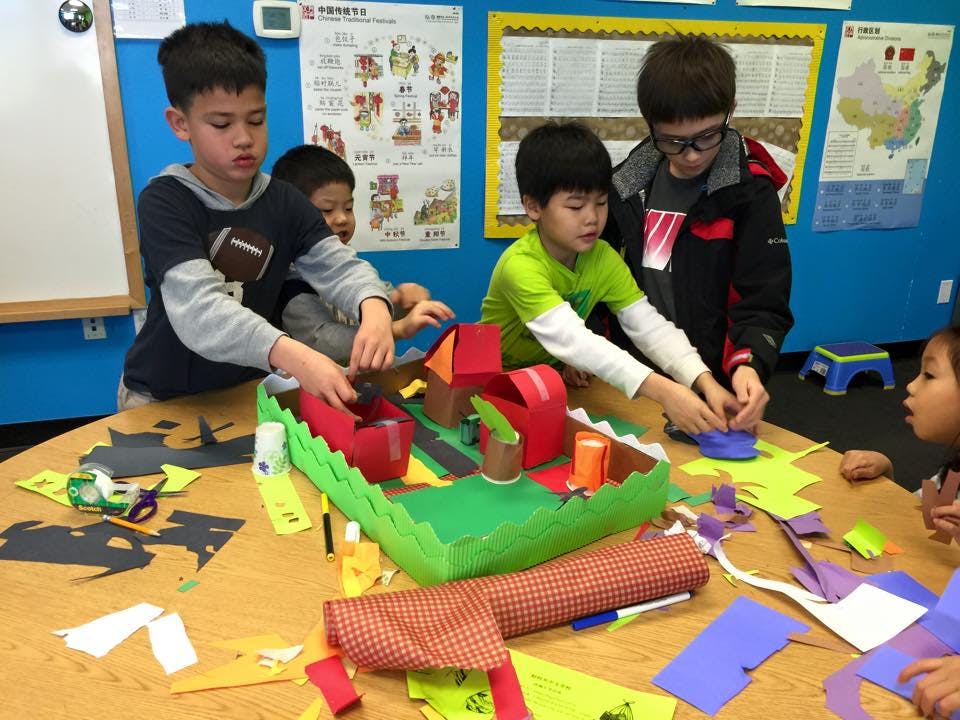 Children working on a craft project in a classroom