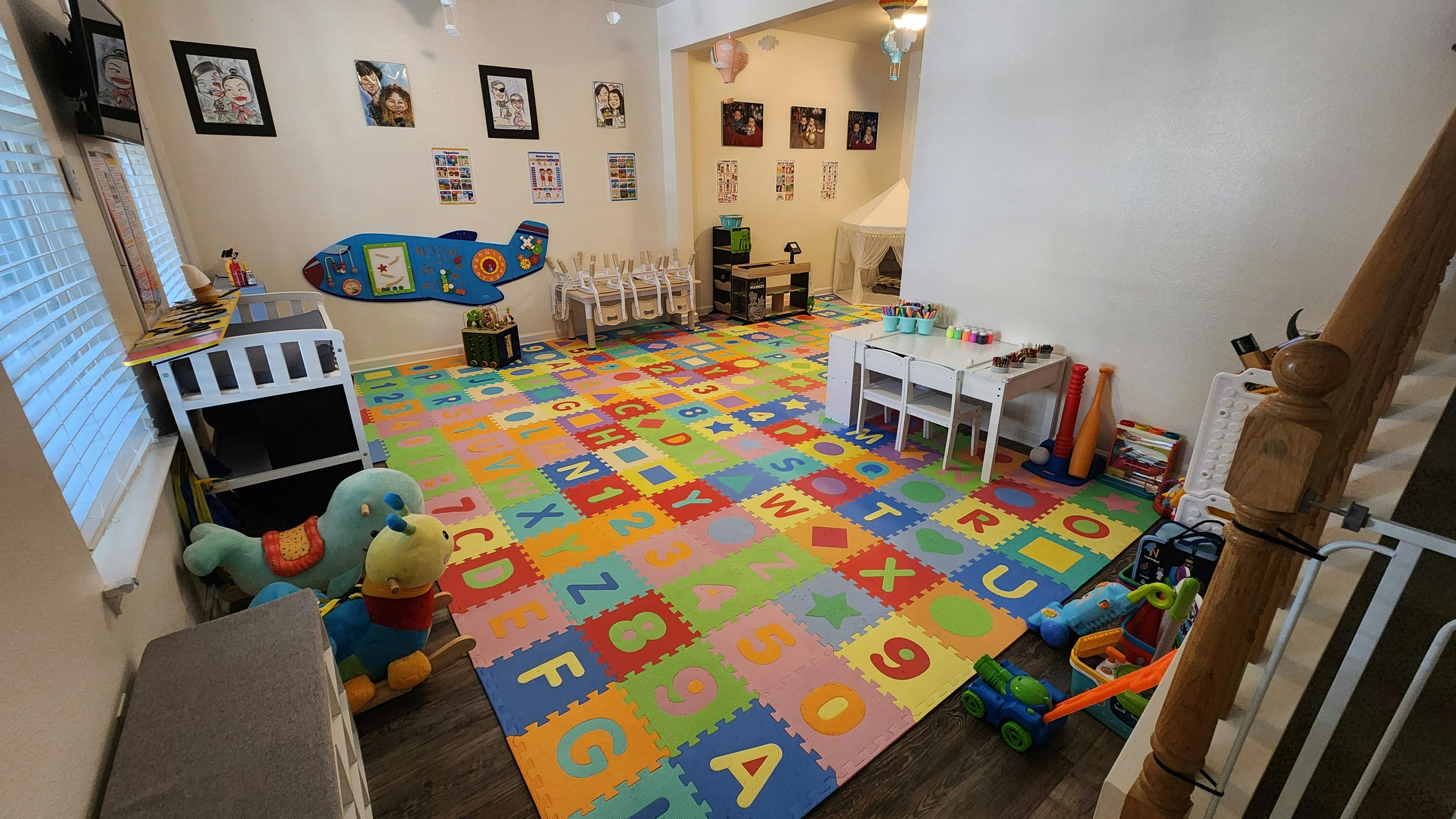 Playroom with colorful alphabet and number floor mats