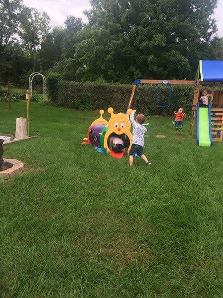 Children playing on outdoor playground equipment