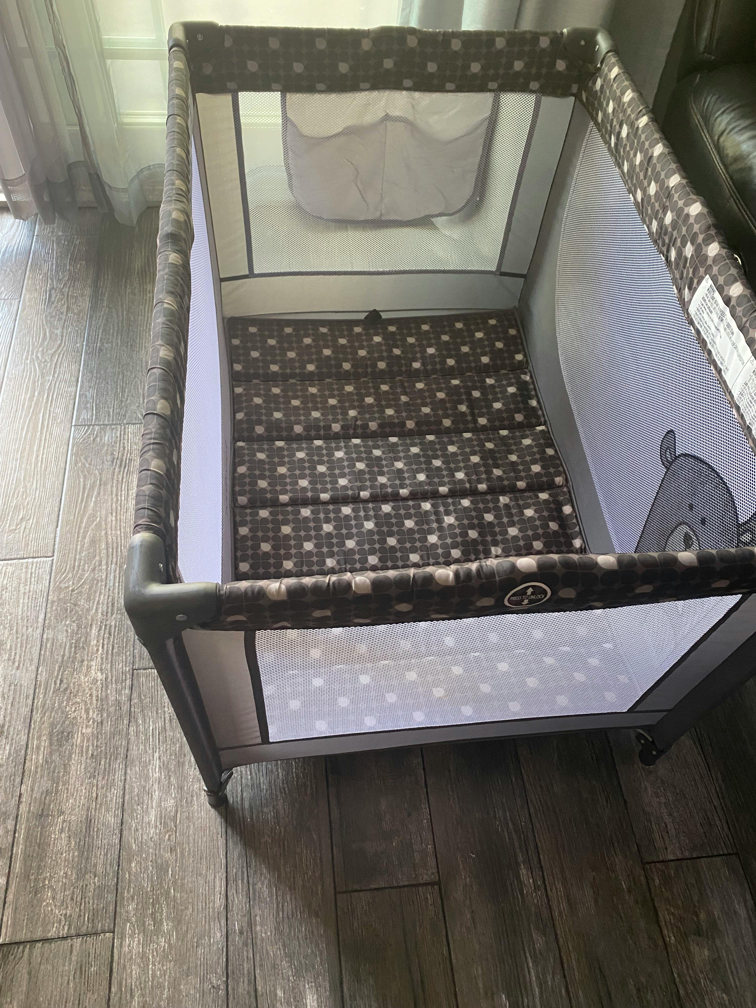 Portable playard with a patterned mattress