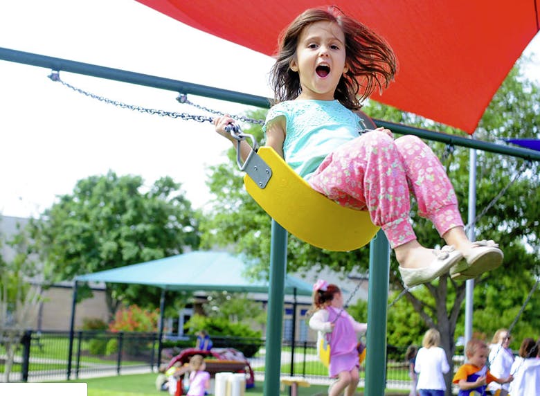 Child on a swing at a playground