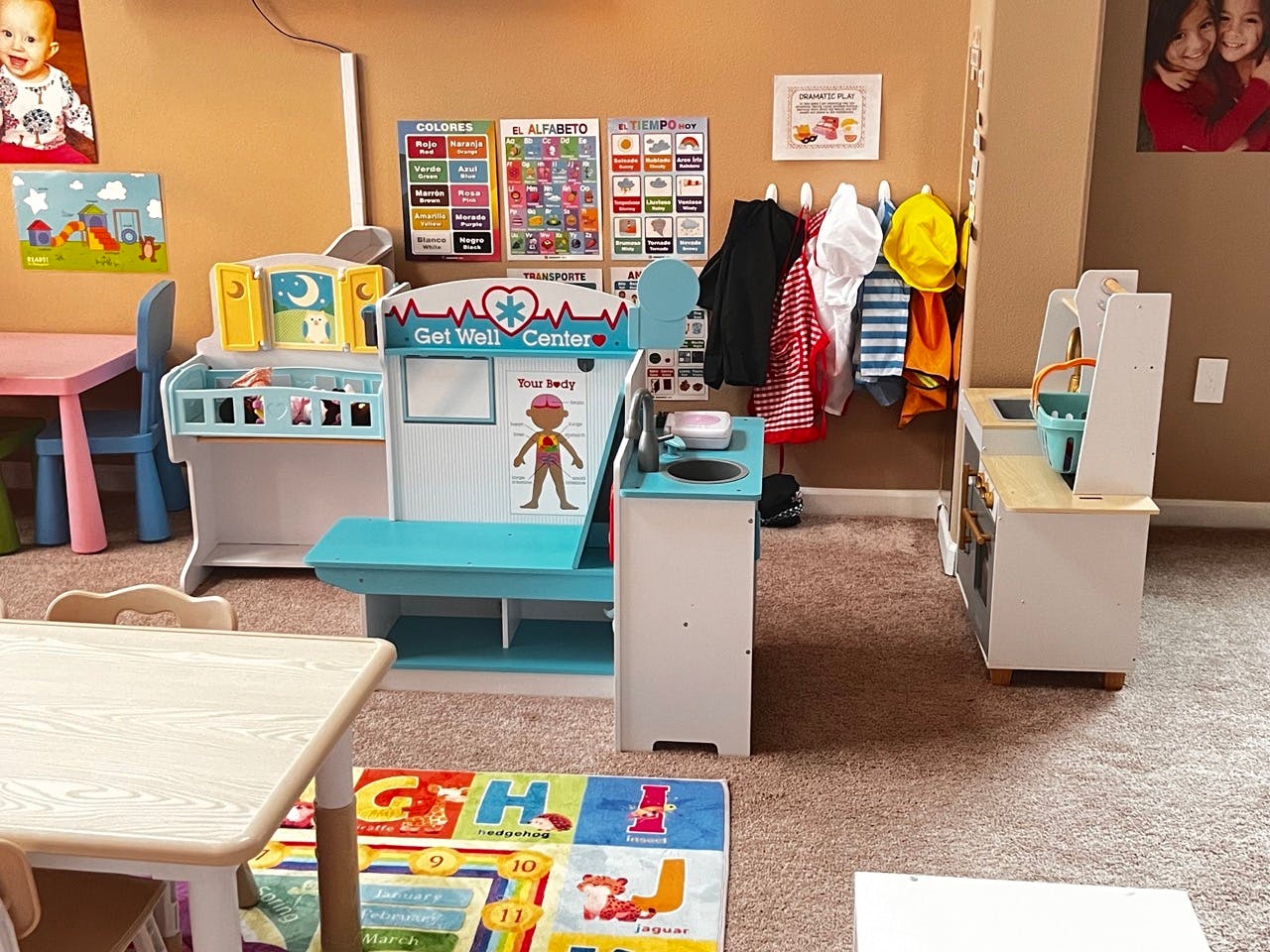 Children's play area with a toy doctor's office and kitchen