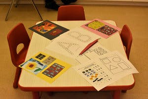 Child-sized table with art supplies and drawings