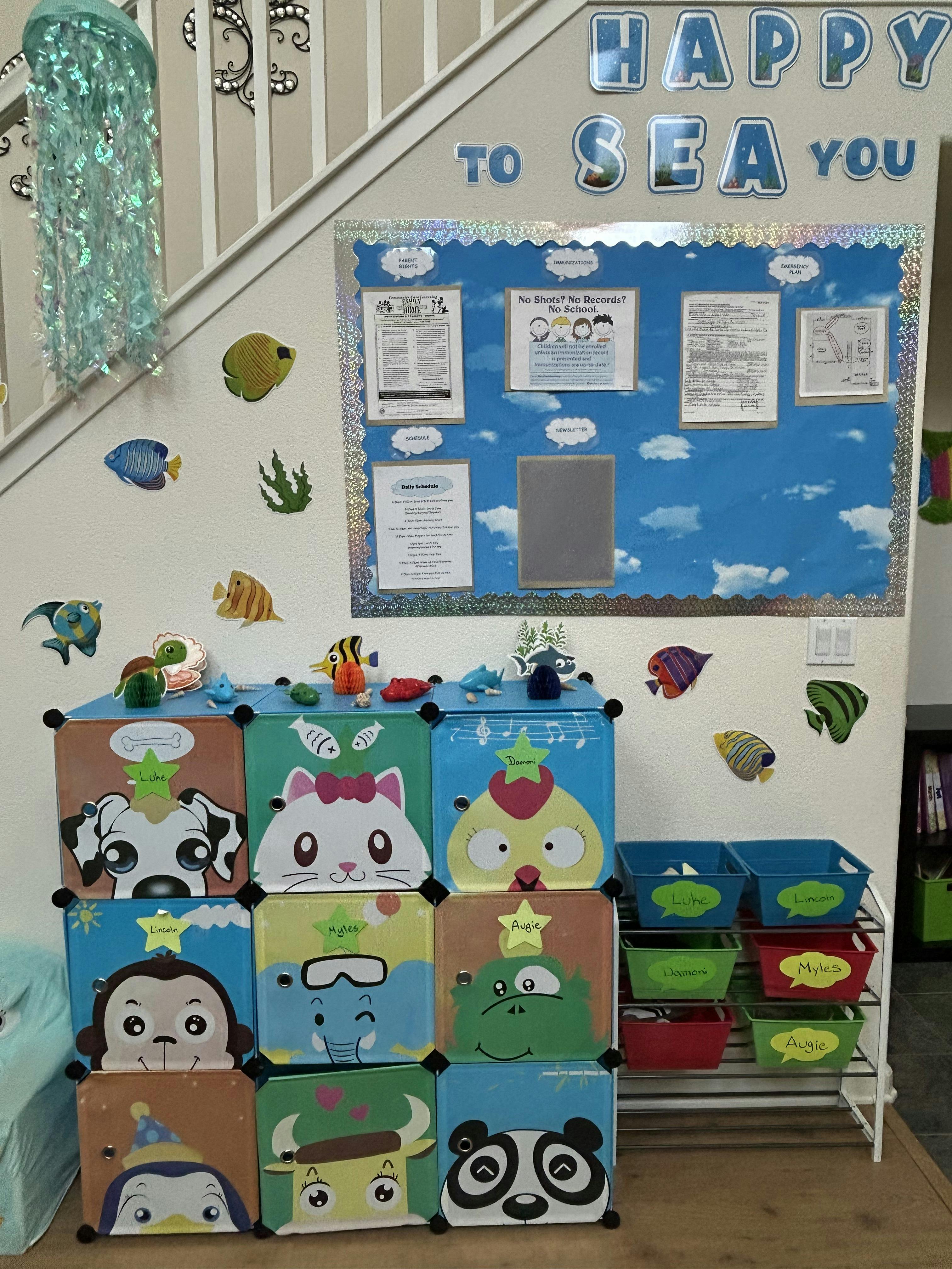 Storage cubes with cartoon animal faces and a bulletin board with text