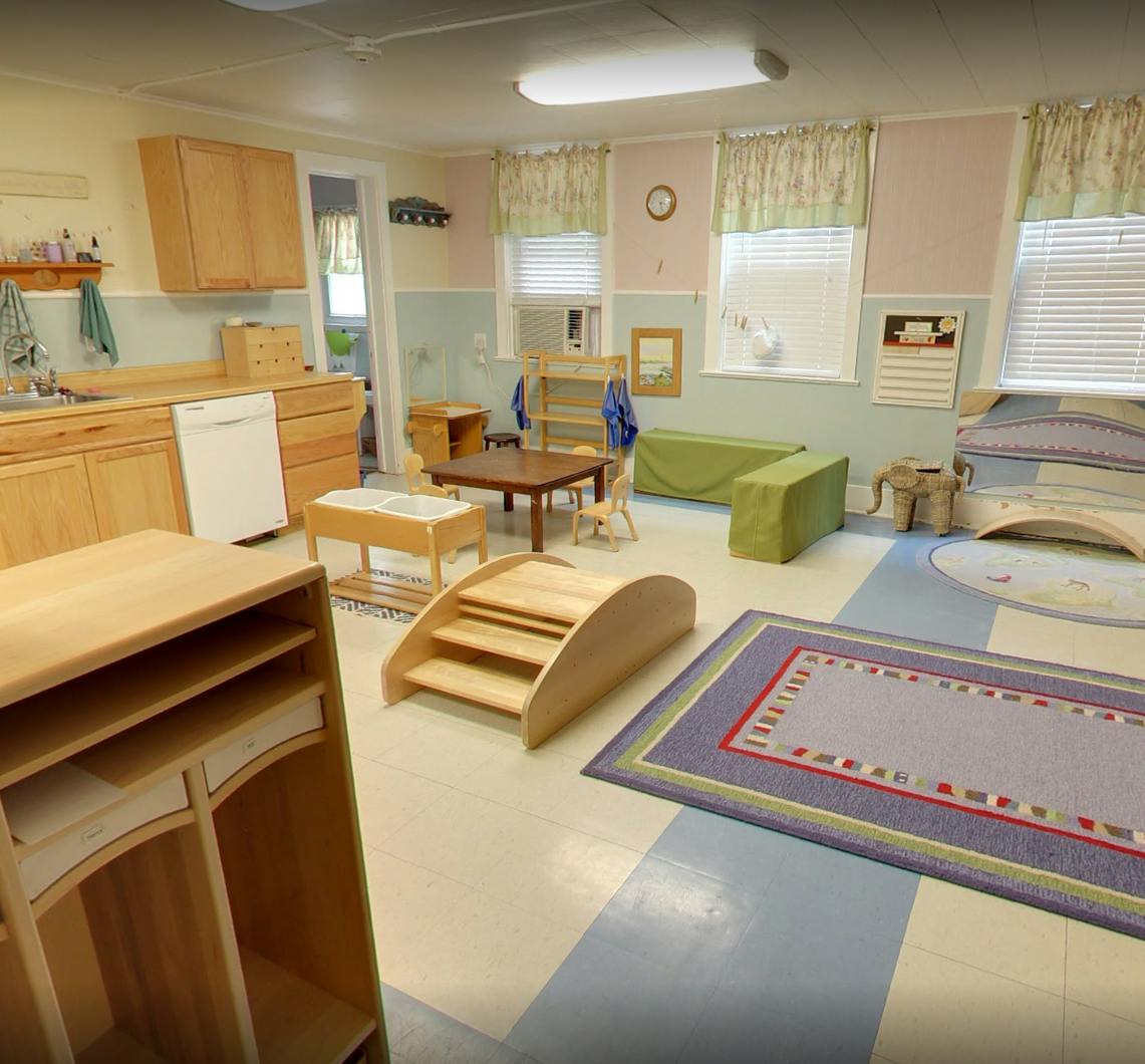 Classroom with child-sized furniture and play equipment