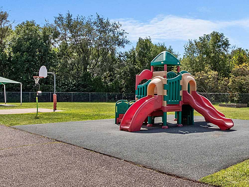 Playground with slides and a basketball hoop