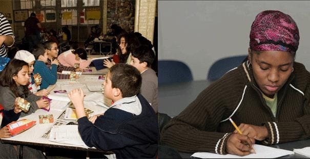 Group of children at tables and a person writing at a desk