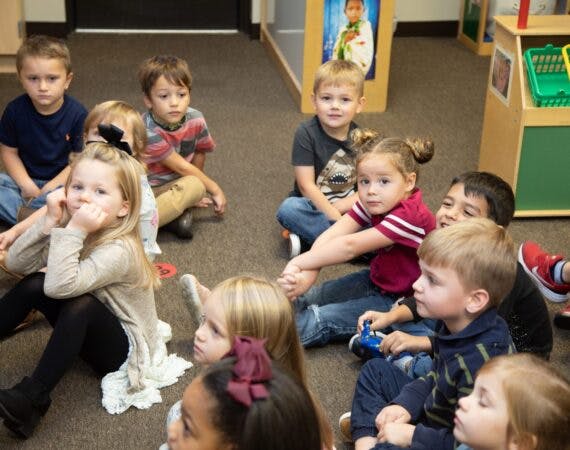 Group of children sitting on the floor