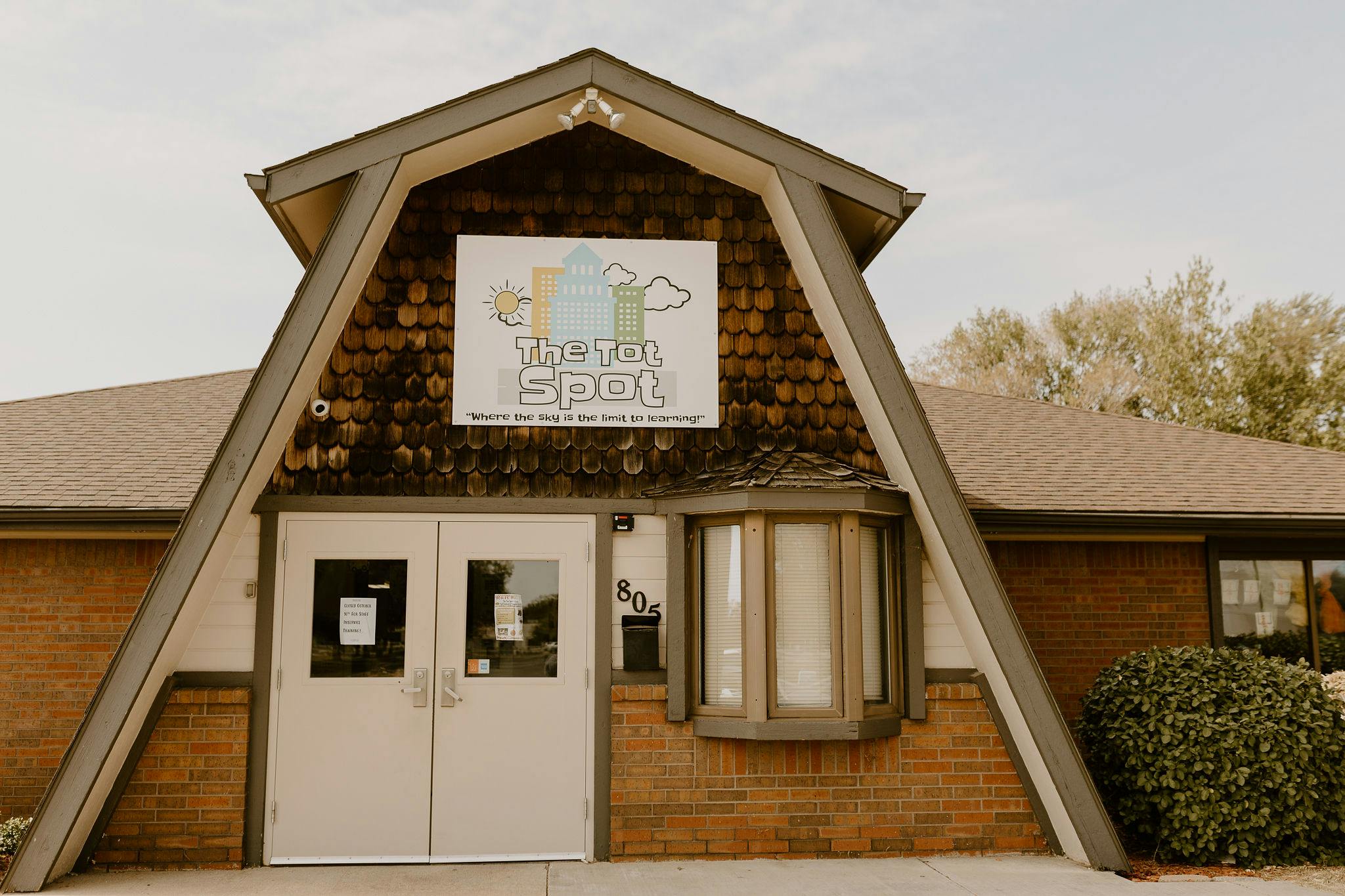 Building with a sign that reads "Youth Spot"