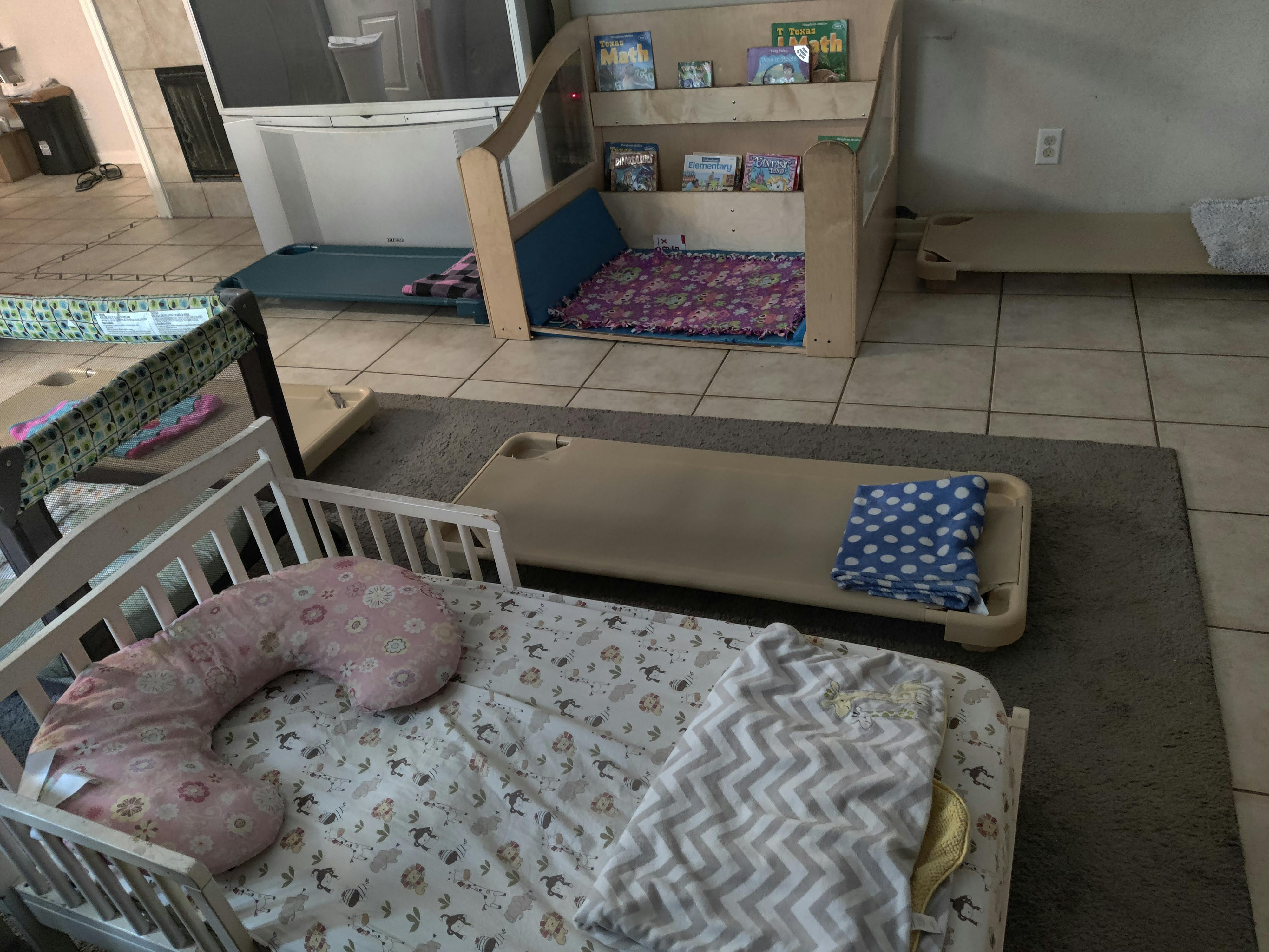 Cribs and cots in a room
