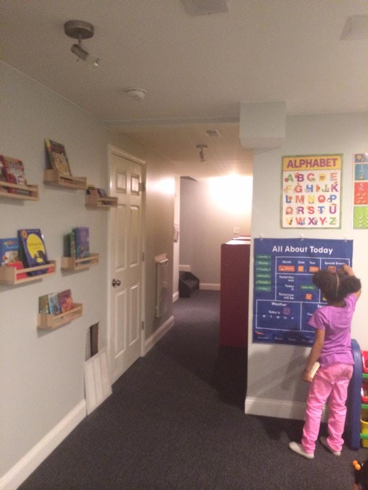 Child looking at a learning chart on a wall