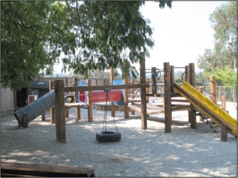 Playground with slides, tire swing, and climbing structure