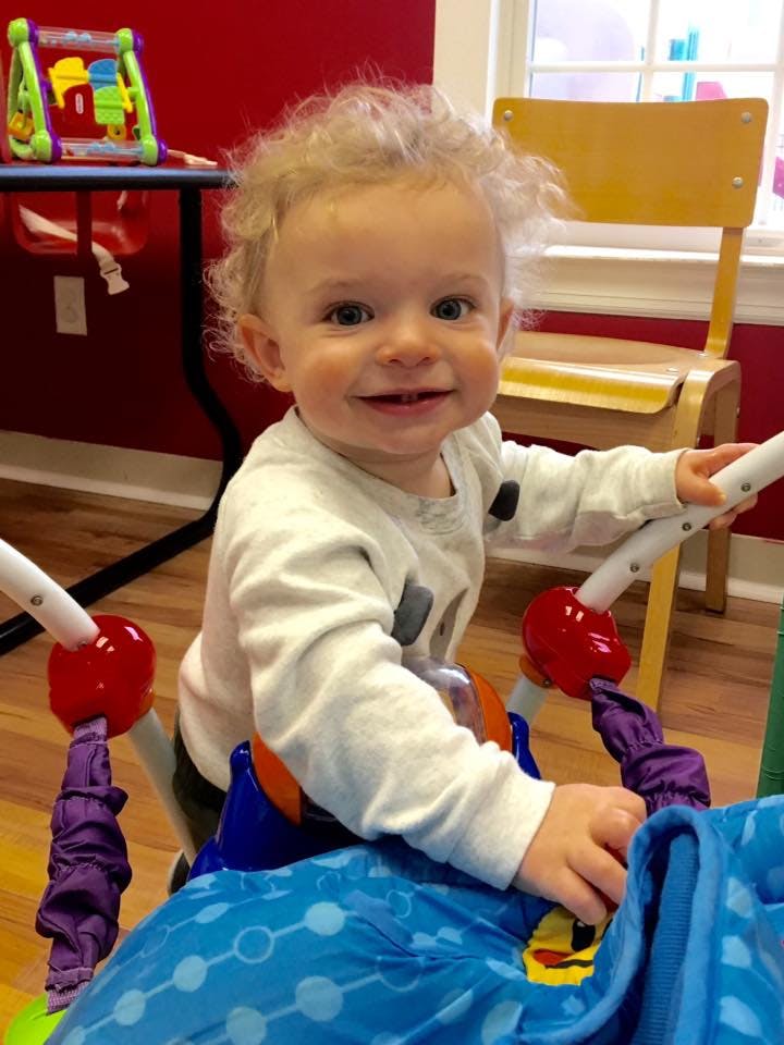 Child in a baby bouncer