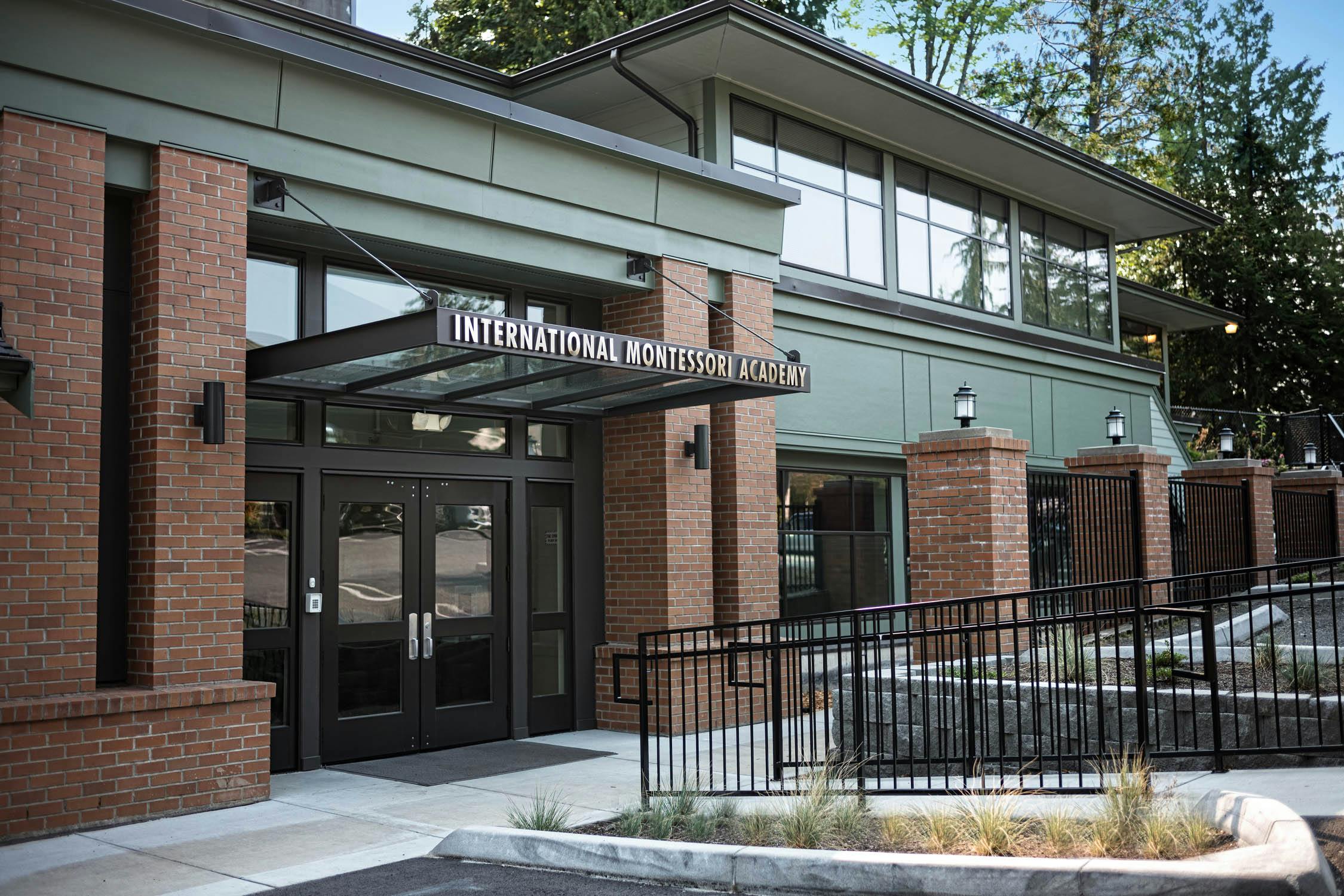 Building exterior with "International Montessori Academy" sign above double doors