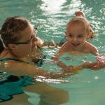 Person in water with a child