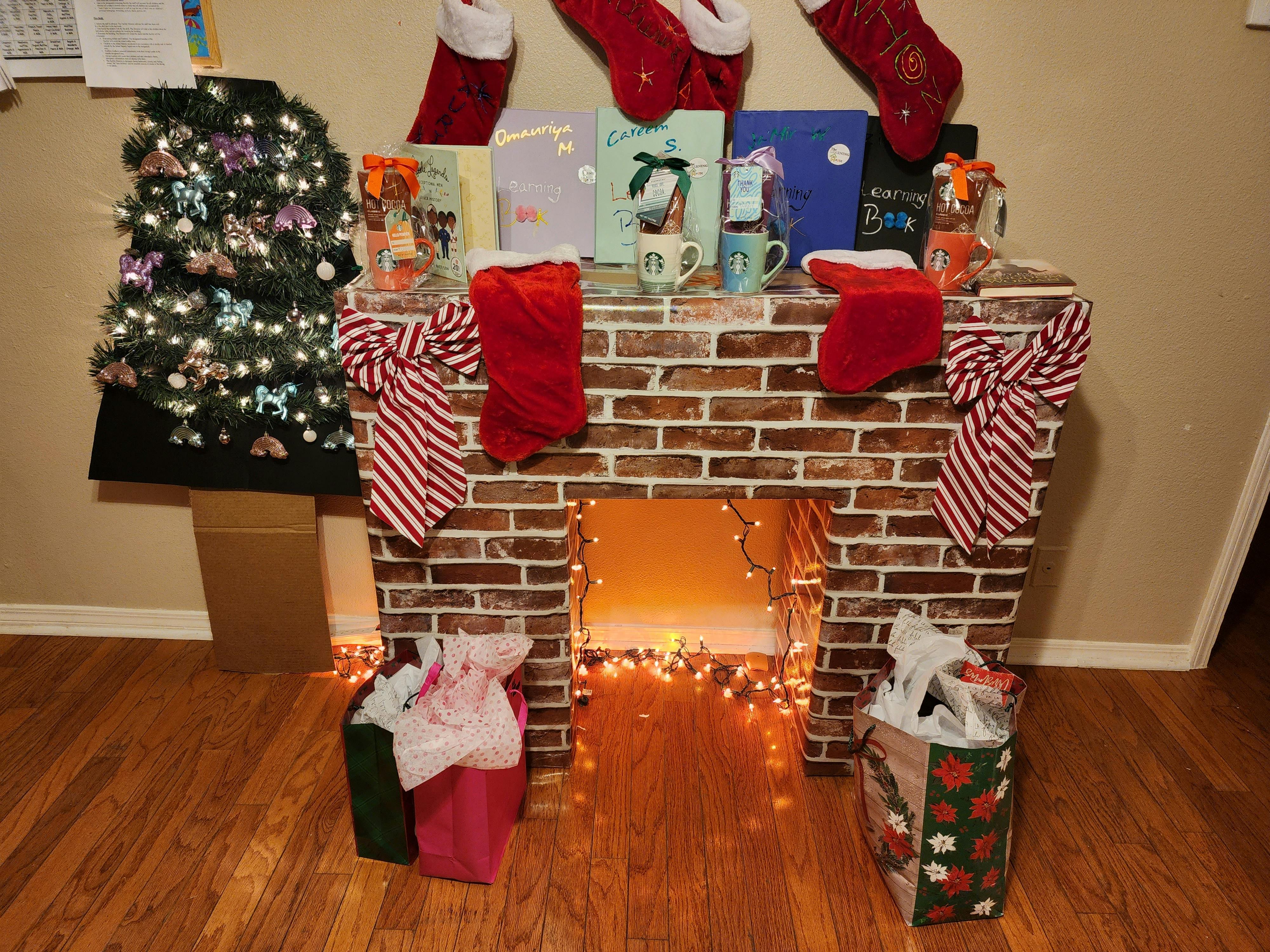 Christmas decorations with a faux brick fireplace, stockings, and gifts