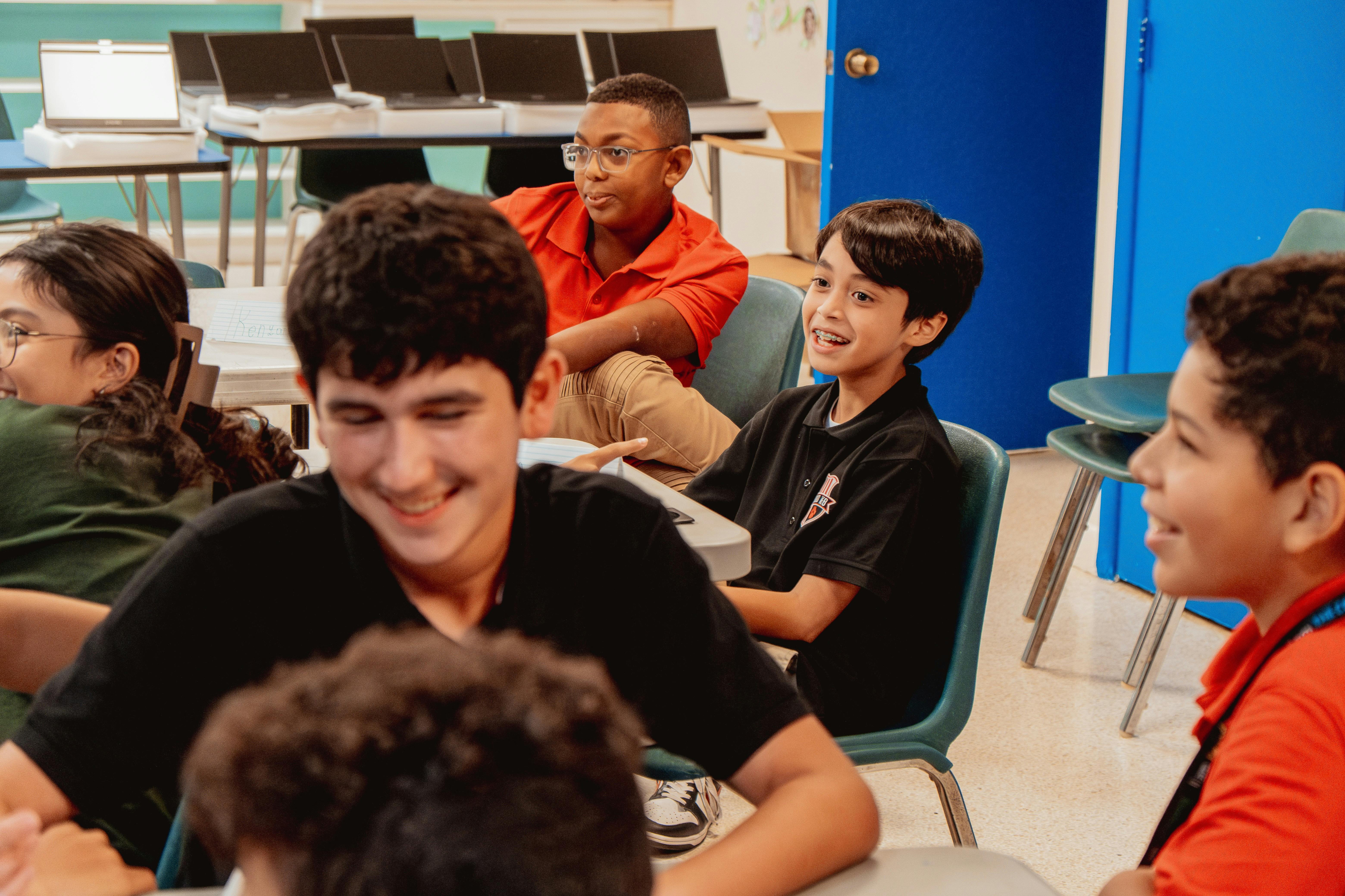Group of children sitting at desks in a classroom