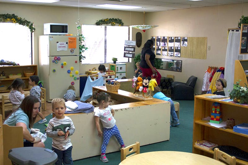 Adults and children in a classroom